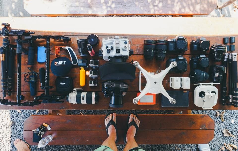 Drone and flight gear laid out on a work surface